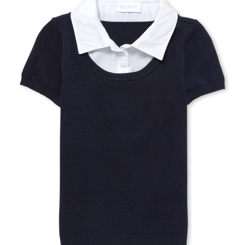 Girl’s navy pullover blouse in sweater.